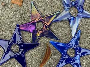 Variations of blue stars. Left to right: Cobalt, Irodized Cobalt, Mottled Blue and White, Light Blue